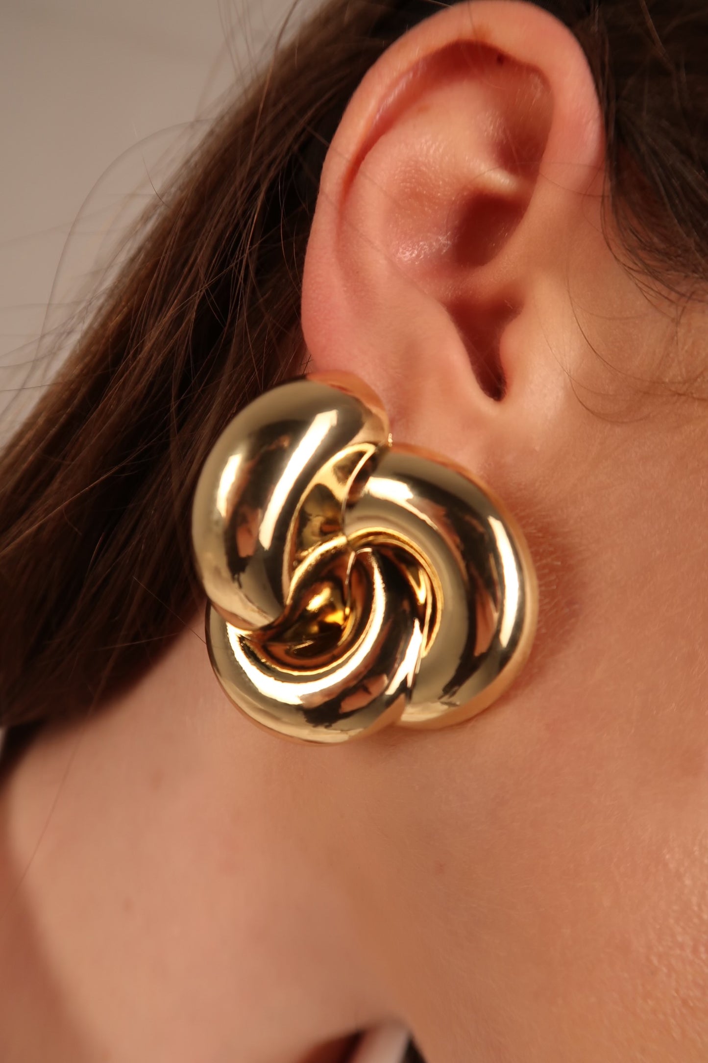 Twist knot gold earrings